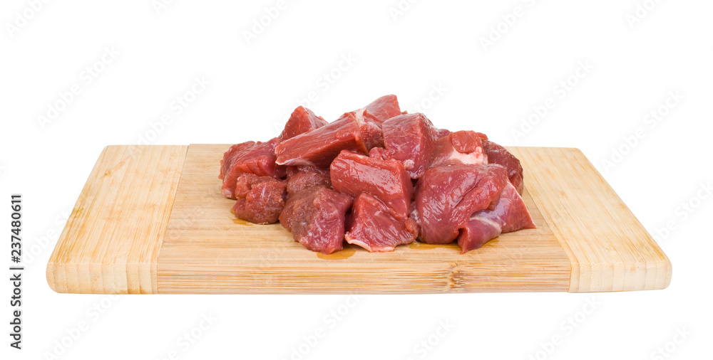 fresh meat on a wooden cutting board isolated on white background