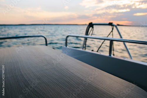  wooden table on a yacht, boat on the background of the sea.