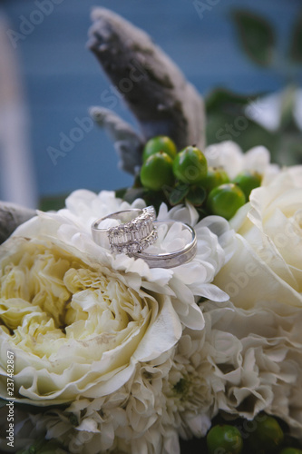 Wedding rings on bouquet of flowers