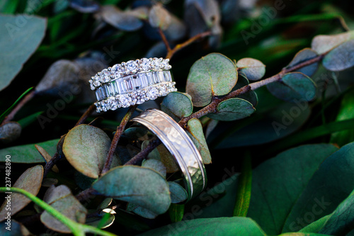 Wedding rings on greenery