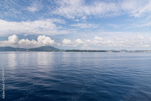 Corfu Island Greece and clouds over it.