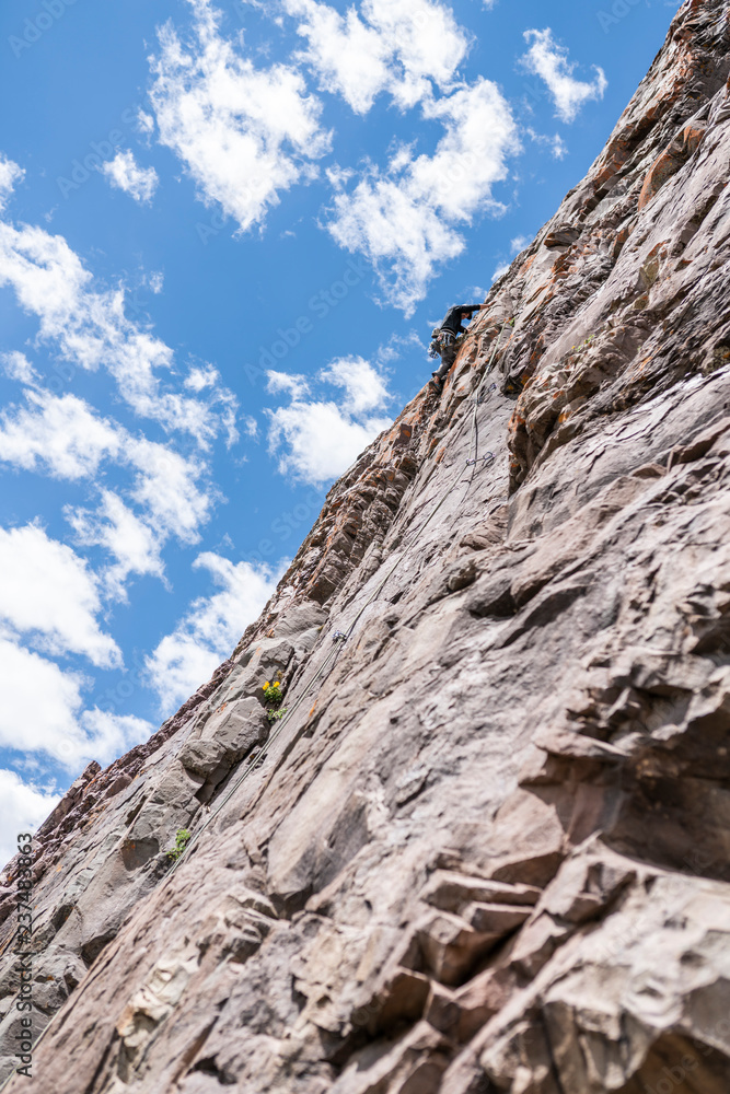 The last movements to reach the summit by a male climber. Rock climbing inside Andes mountains and valleys at Cajon del Maipo, an amazing place to enjoy rock climbing and mountaineering sports, Chile
The last movements to reach the summit by a male climber. Rock climbing inside Andes mountains and valleys at Cajon del Maipo, an amazing place to enjoy rock climbing and mountaineering sports, Chile