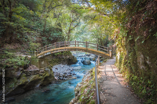 Stone bridge on the river in the forest near Amanoyasugawara Shrine, Takachiho, Miyasaki, Kyushu, Japan