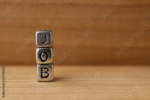 Metal cubes on a red wooden table