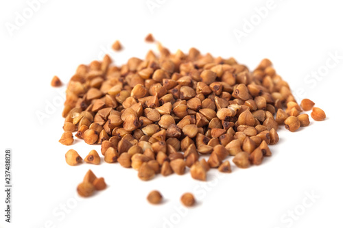 Buckwheat grain isolated on white background, healthy wood