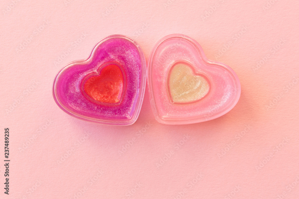Two funny hearts on a pink background. The concept of Valentine's day Two funny hearts on a pink background. The concept of Valentine's day