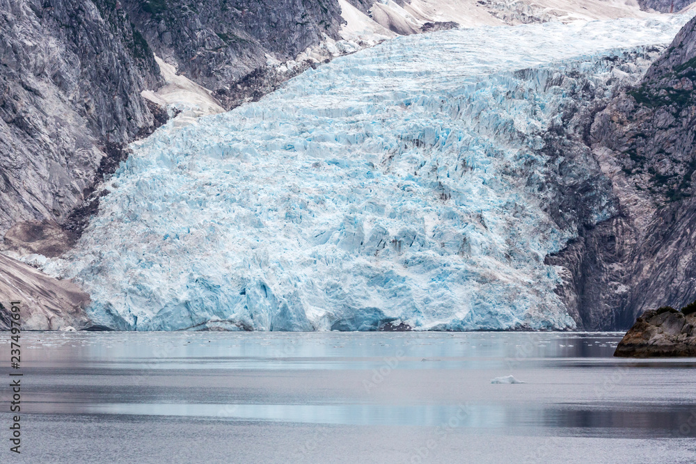 A glacier with blue ice in Kenai Fjords National Park in Alaska. A glacier with blue ice in Kenai Fjords National Park in Alaska.