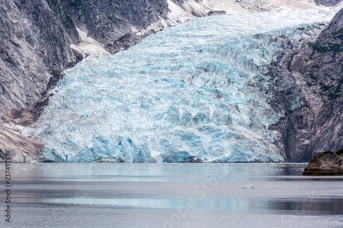 A glacier with blue ice in Kenai Fjords National Park in Alaska.  photo