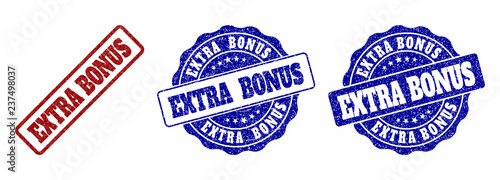EXTRA BONUS grunge stamp seals in red and blue colors. Vector EXTRA BONUS overlays with grunge effect. Graphic elements are rounded rectangles, rosettes, circles and text labels.