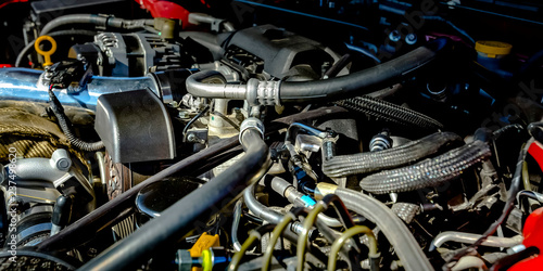 Close up view of a car engine on a sunny day