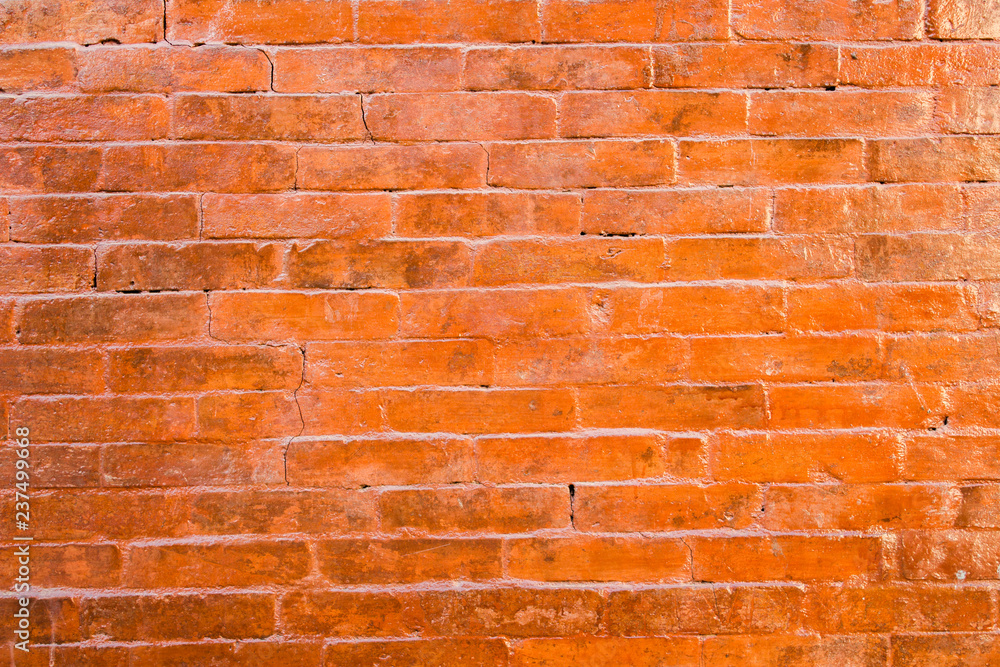 Fototapeta premium old red brickwork with cracks. rough surface texture. brick wall