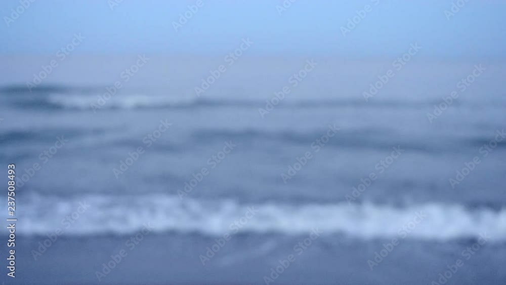 Blurred background sea in the evening at dusk with waves and white foam Blurred background sea in the evening at dusk with waves and white foam