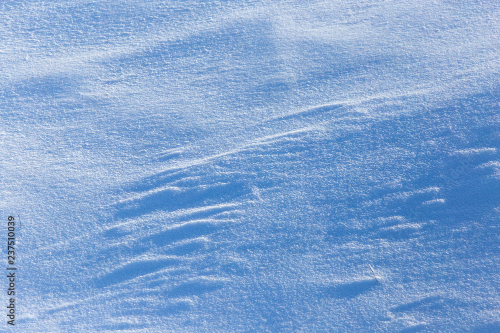 White snow on the mountainside as a background White snow on the mountainside as a background