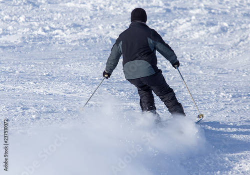 Man skiing in the snow in winter