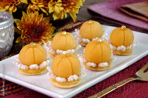 Thai dessert / Royal Thai cuisine : Golden crown cake (Khanom Dara Thong or Thong Eak krajang) , one of famous nine auspicious desserts in Thai tradition, made from yolk, wheat flour and edible gold photo