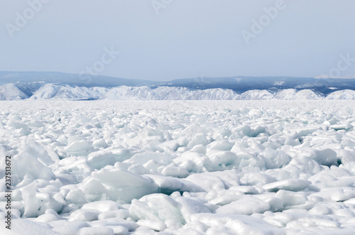 Strait Small Sea of Lake Baikal in winter. Ice crackes and splinters under snow