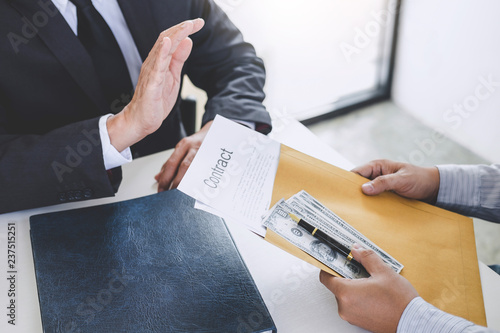 Photography Bribery and corruption concept, senior businessman manager refusing receive mone