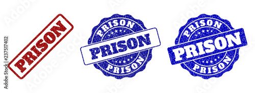 PRISON grunge stamp seals in red and blue colors. Vector PRISON imprints with grunge surface. Graphic elements are rounded rectangles, rosettes, circles and text captions.