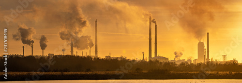Smoking chemical plant chimneys,panorama.Air environment pollution concept.