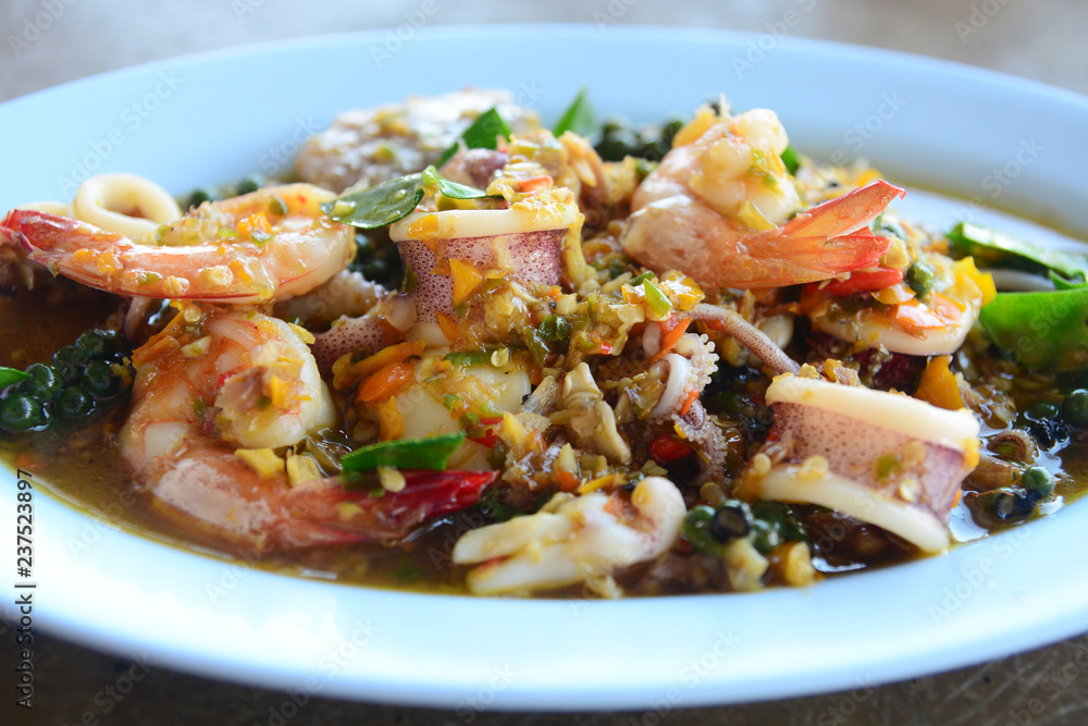 Thai Fried stir spicy sea food in white dish. Thai Fried stir spicy sea food in white dish.