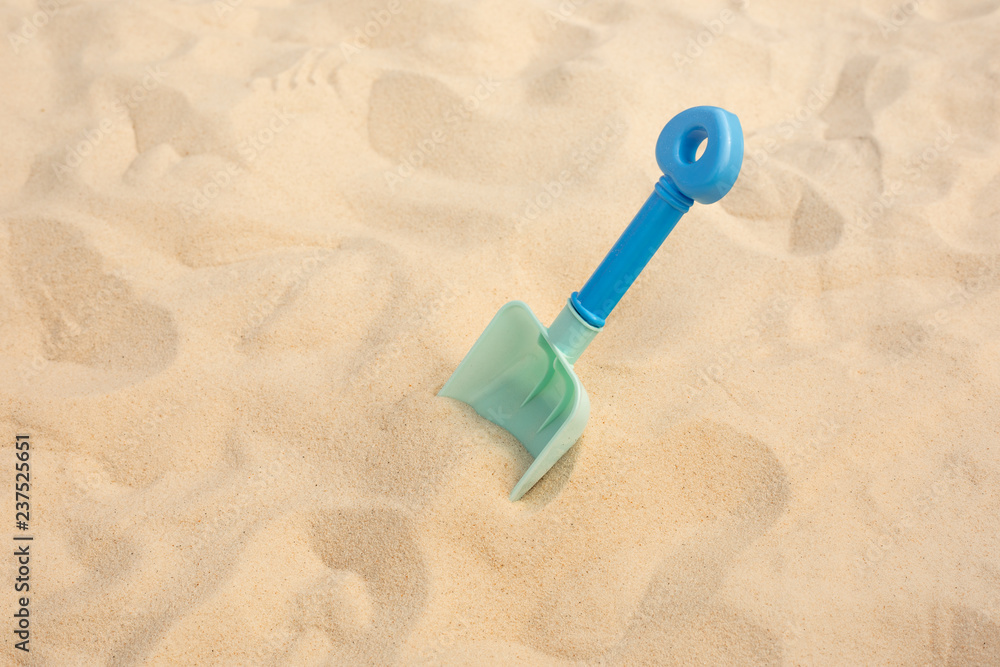 Shovel toy on sand,beach summer and vacation concepts Shovel toy on sand,beach summer and vacation concepts