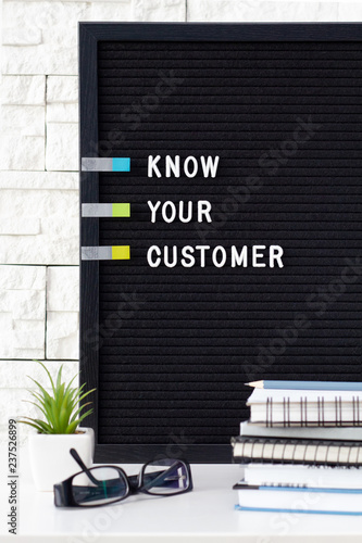 KYC or know your customer concept. Idea of business identification and finance safety. Cyber crime, white text message on black board with sticky notes