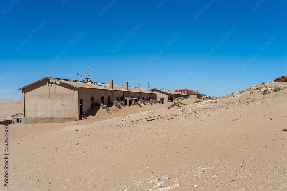 Kolmanskuppe, aslo known as Kolmanskop, a diamond mining ghost town on the Skeleton Coast of Namibia. Kolmanskuppe, aslo known as Kolmanskop, a diamond mining ghost town on the Skeleton Coast of Namibia.