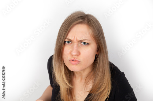 portrait of beautiful angry woman on white background
