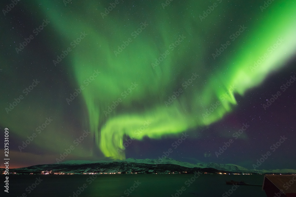 The polar arctic Northern lights aurora borealis sky star in Norway Svalbard in Longyearbyen city  mountains