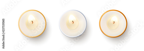 Set of top view burning candles isolated on white background.