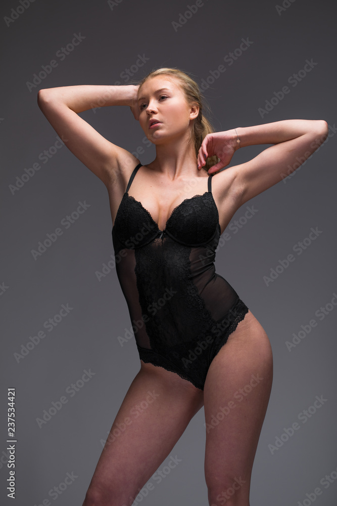 Full portrait of sexy lady in black underwear