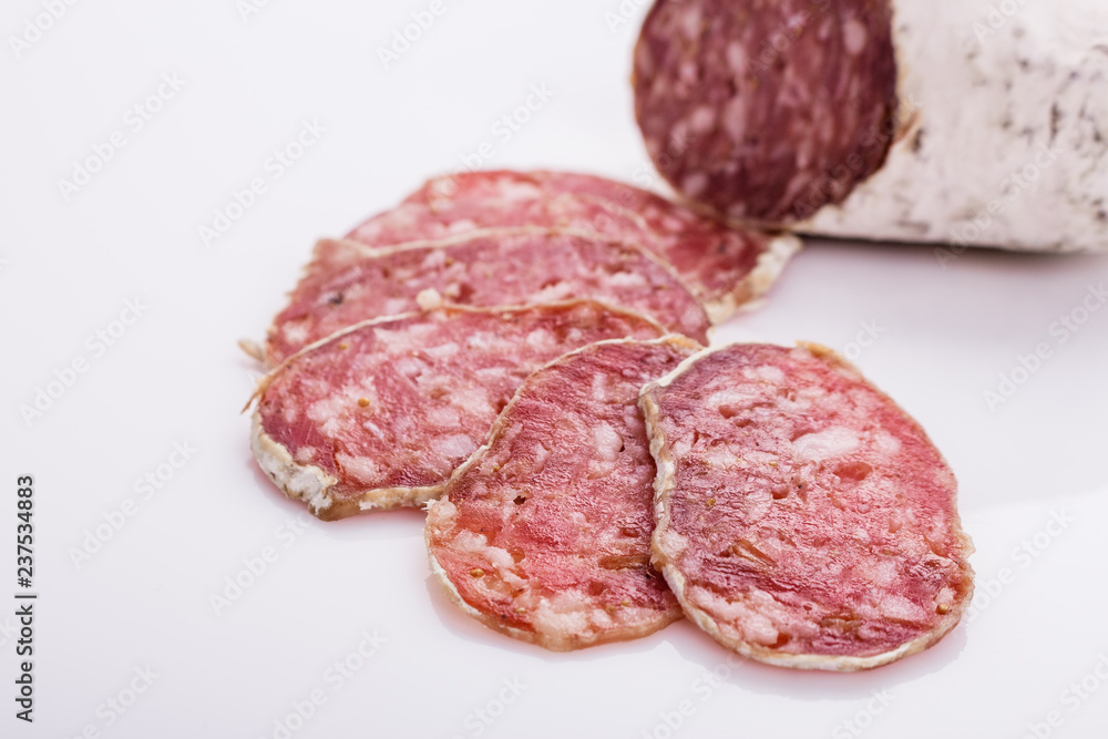 Saucisson sec delicious french salami on a white background Saucisson sec delicious french salami on a white background
