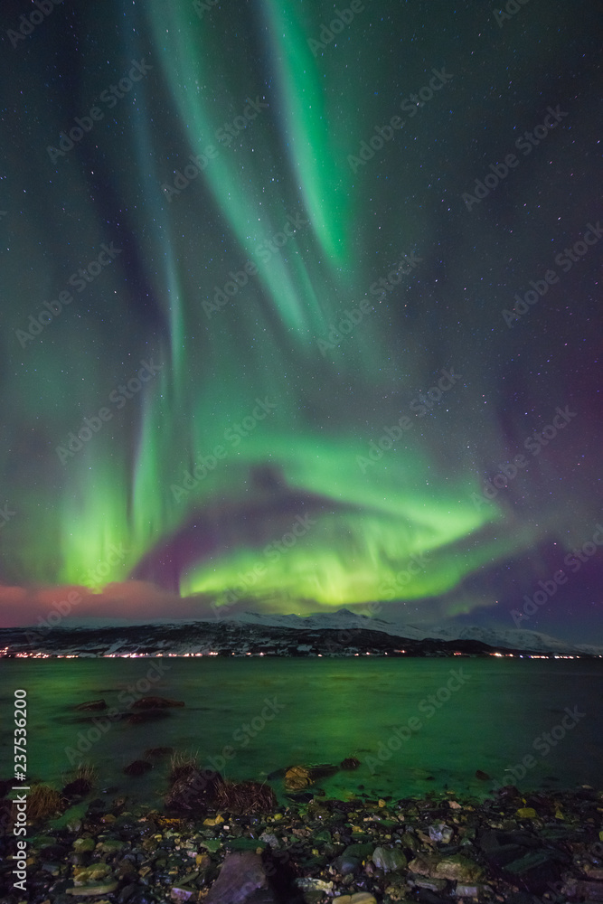 The polar arctic Northern lights aurora borealis sky star in Norway Svalbard in Longyearbyen city  mountains