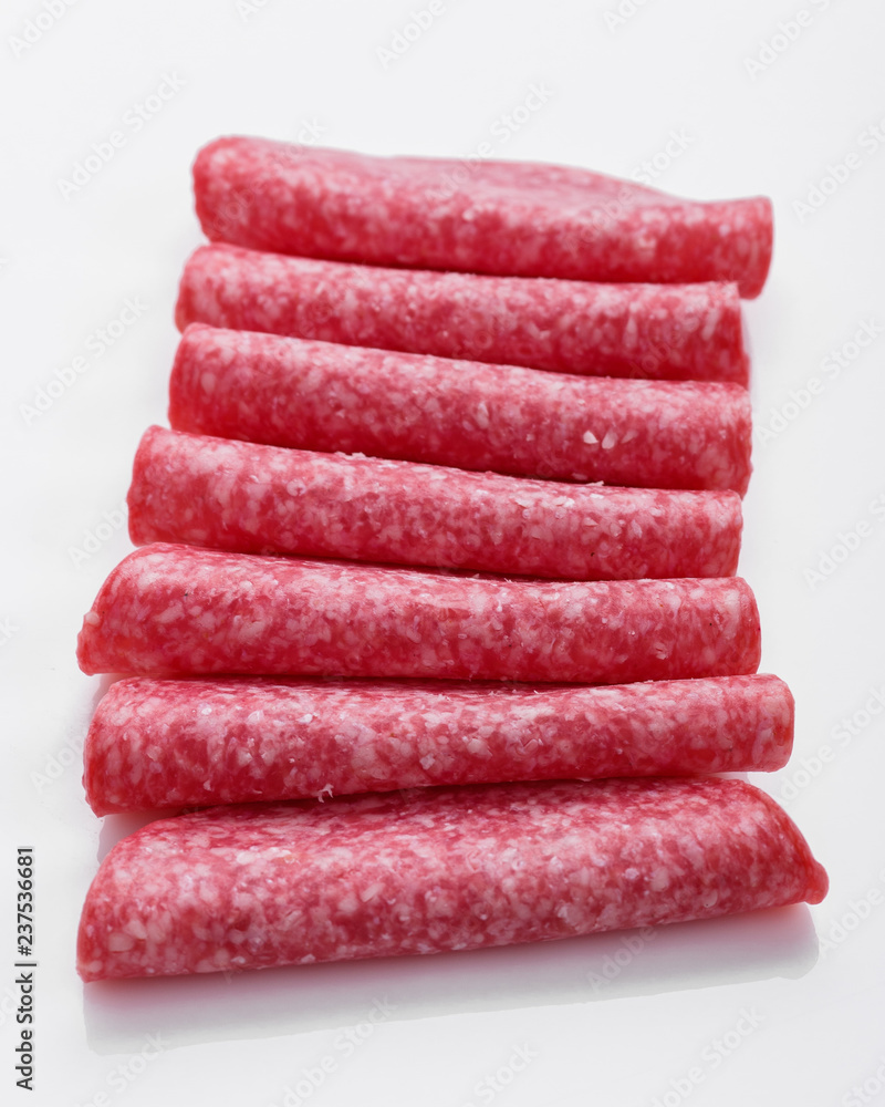 delicious sliced salami on a white background delicious sliced salami on a white background