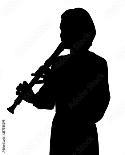 Young woman playing recorder flute