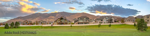 Homes overlooking mountain and a landscaped lawn
