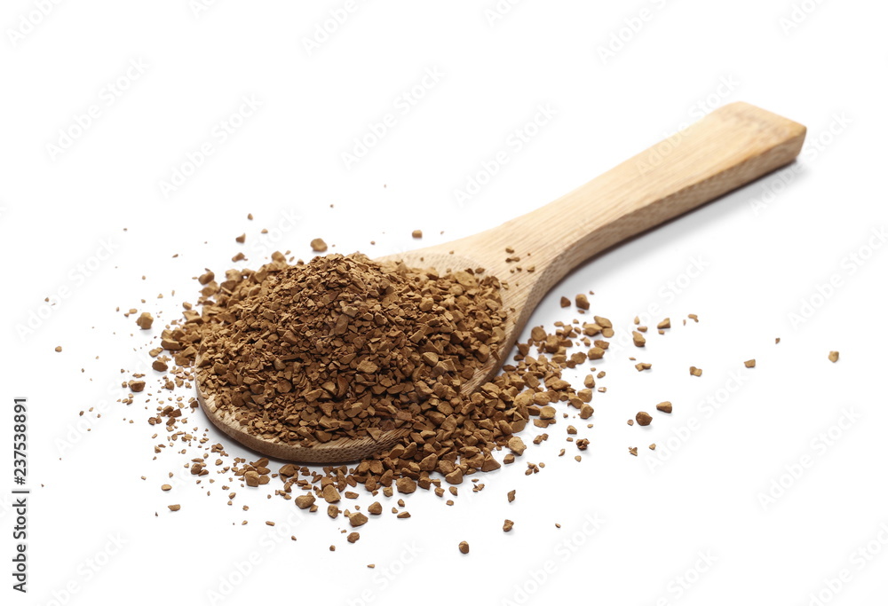 Instant coffee granules with wooden spoon isolated on white background and texture Instant coffee granules with wooden spoon isolated on white background and texture