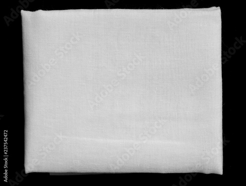 white fabric fold on black background