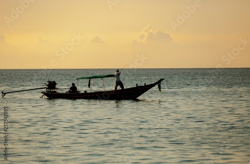 man fishing on long tail boat koh tao island southern of thailand © stockphoto mania