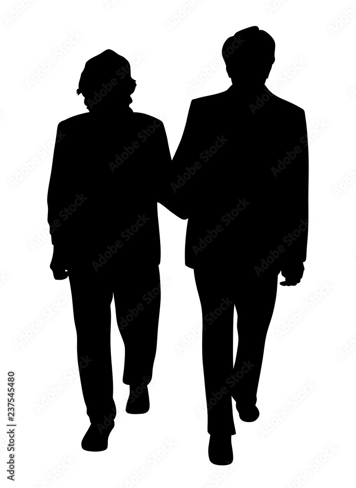 Senior couple walking arm in arm