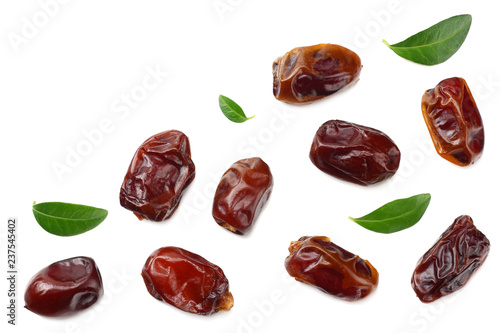 date fruits with green leaves isolated on white background. top view