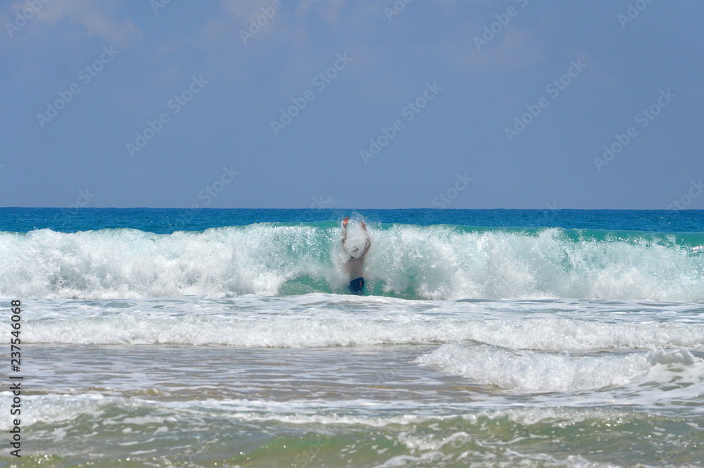 Man inside a big wave. Dangerously strong force of nature. Man inside a big wave. Dangerously strong force of nature.