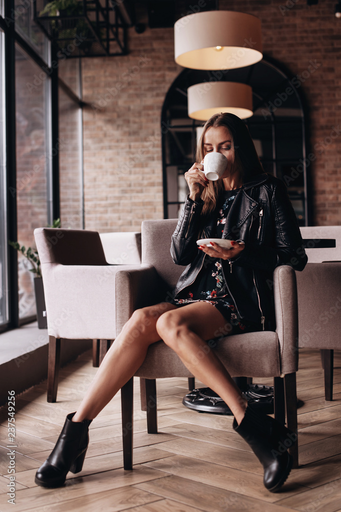 Portrait of the beautiful woman drinking coffee in the morning