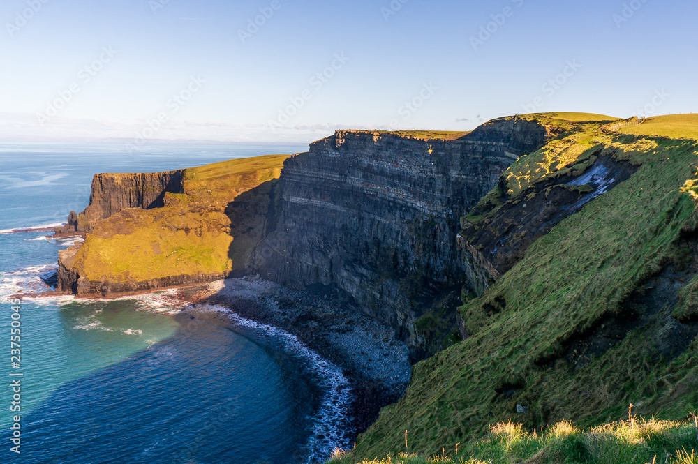 Irish landscape with stunning rugged cliffs facing the Ocean. Cliffs of Moher, Ireland’s most spectacular natural wonder at the heart of the Wild Atlantic Way, County Clare.