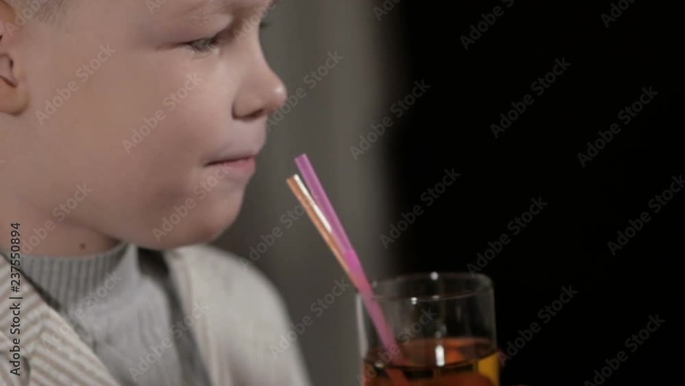 Young boy eating pizza in the restaurant Young boy eating pizza in the restaurant
