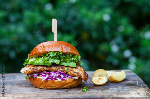 Chicken burger with red cabbage coleslaw and avocado photo