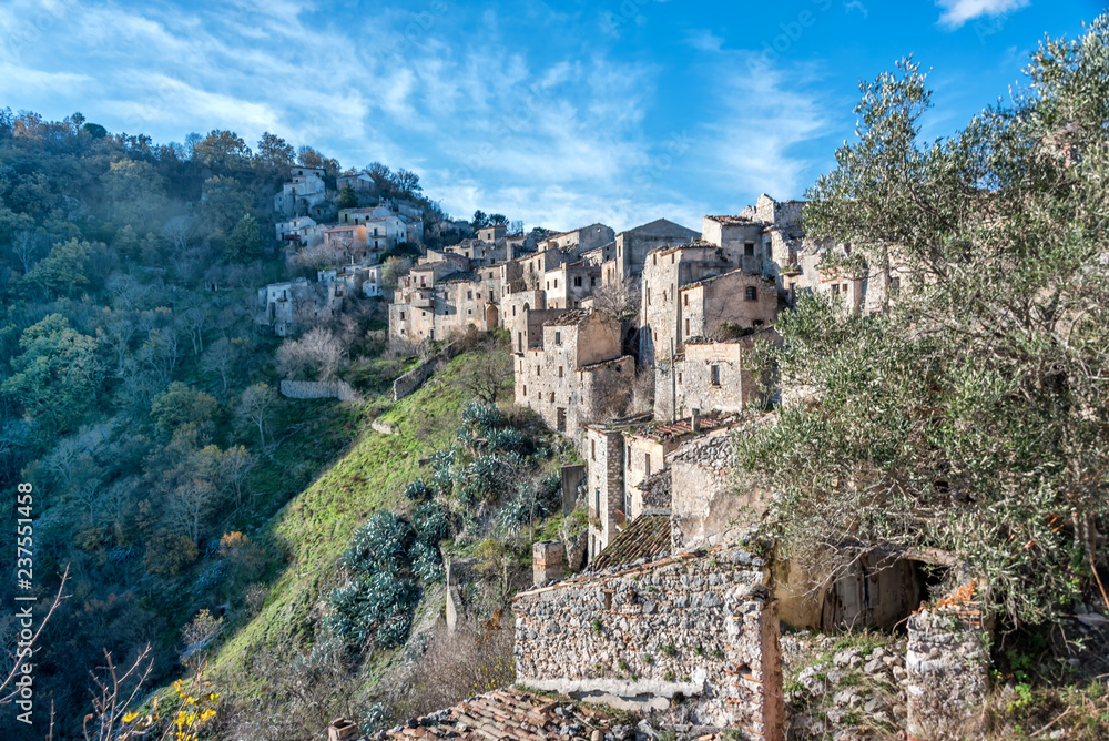 Old Abandoned Stone House and a View of an Abandoned Medieval Village in Southern Italy