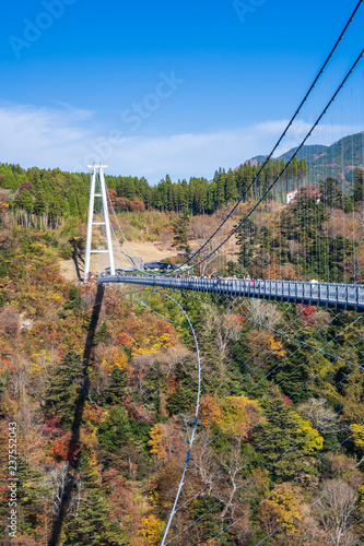 Fototapeta Naklejka Na Ścianę i Meble -  Kuju, oita, Japan, November 11, 2018: Kokonoe Yume Suspension Bridge (otsurihashi), the most highest suspension bridge for walkway in Japan.