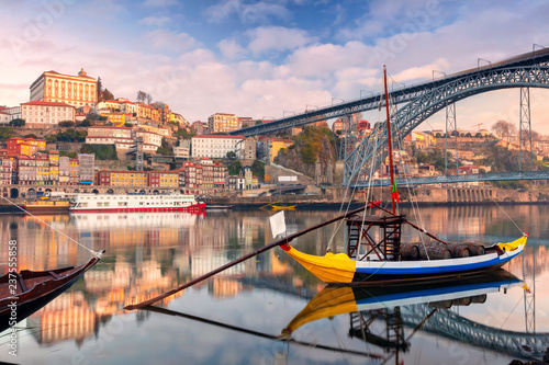 Porto, Portugal. Cityscape image of Porto, Portugal with reflection of the city in the Douro River during sunrise. photo