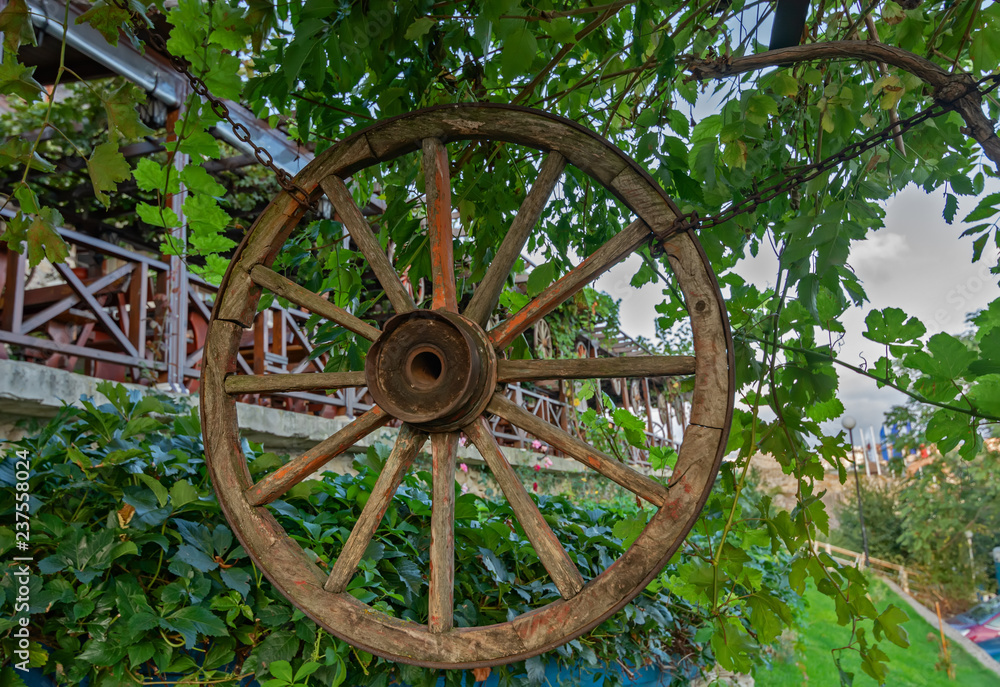 The old wooden wheel used to decorate a seaside restaurant
